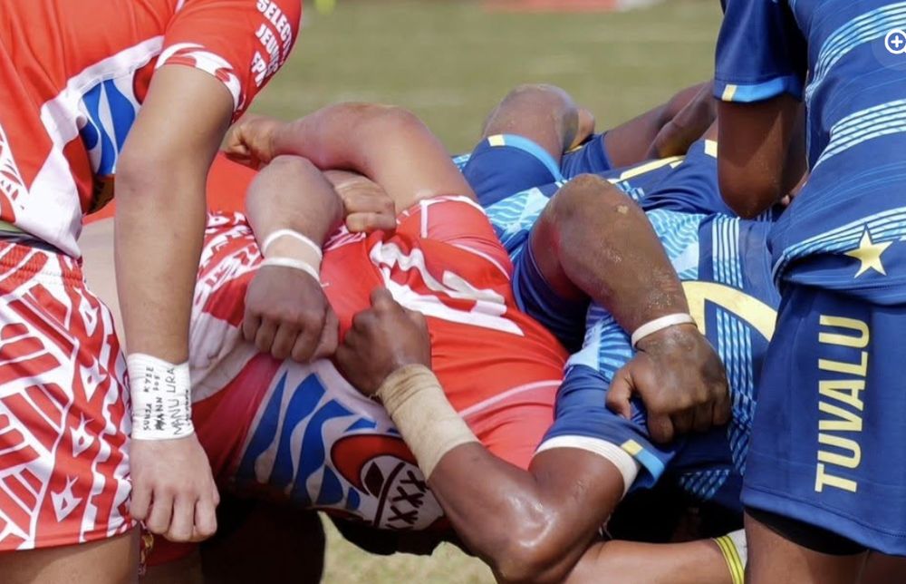 Tuvalu player carrying into contact